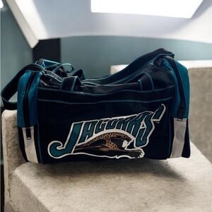 NFL Jaguars Teal and Black Duffel Bag
Official